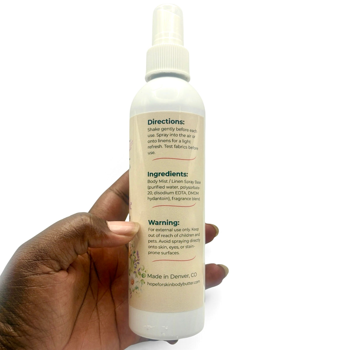 Lavender Chamomile Room + Linen Spray held in hand showing back label