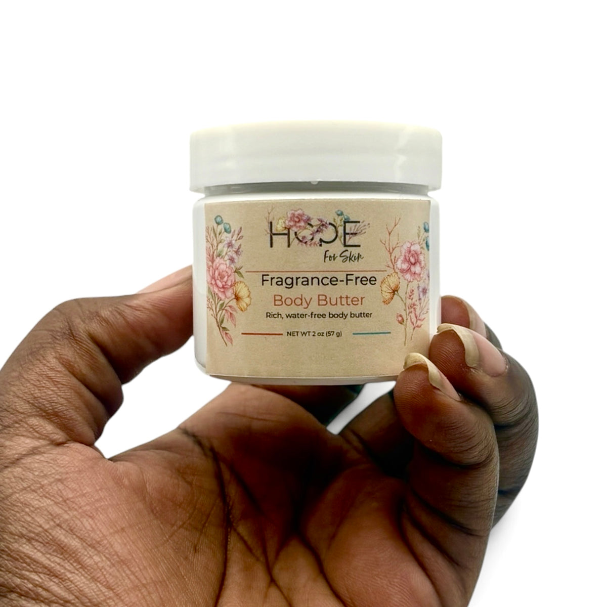 Hope For Skin Fragrance-Free Body Butter 2 oz held in hand